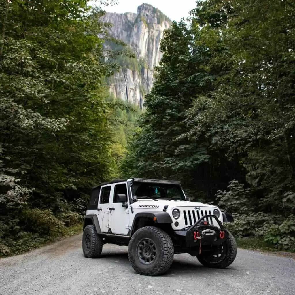 white_jeep_rubicon_in_woods.jpeg